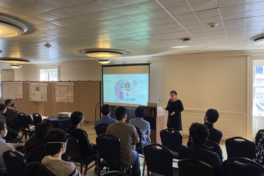 Someone giving a presentation at the IB Symposium